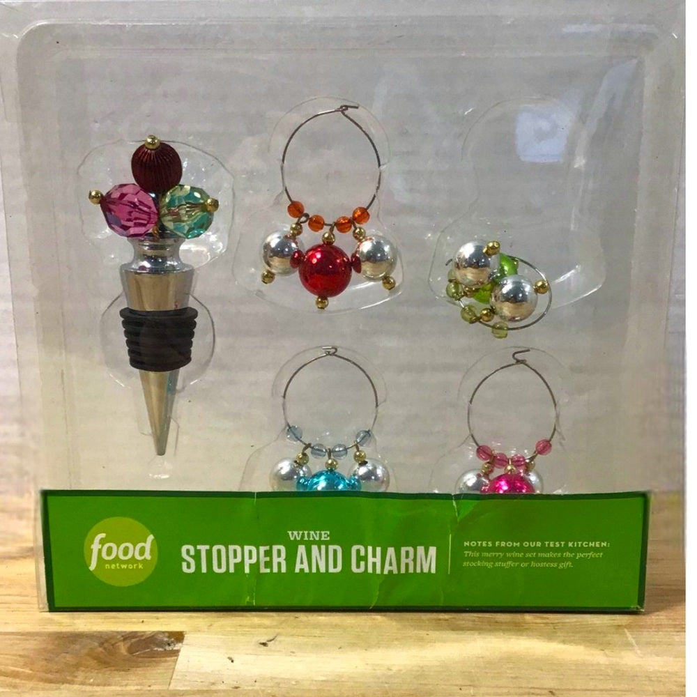 Wine stopper and charms in their original packaging